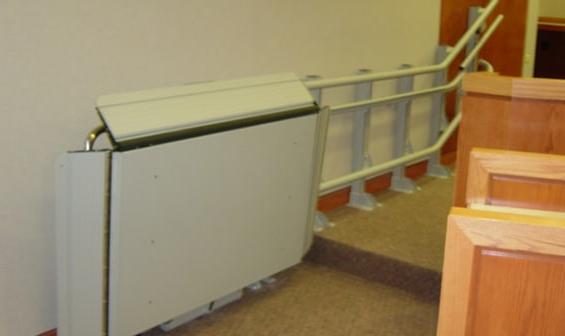 Indoor wheelchair lift in public building by Garaventa